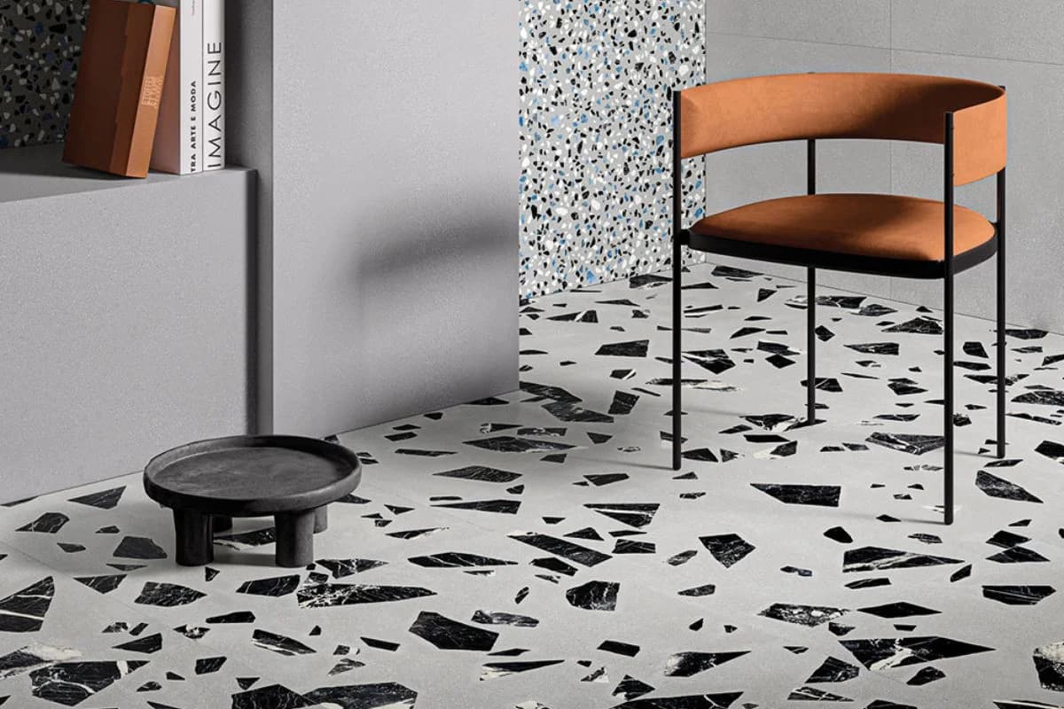 Contemporary living space with black and white terrazzo flooring and modern furniture in Khobar, Saudi Arabia
