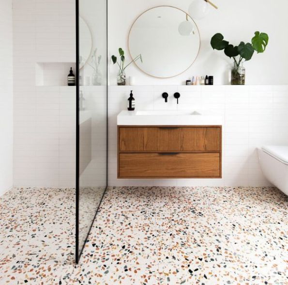 "Neutral-tone terrazzo flooring in Riyadh bathroom, featuring sleek and water-resistant surfaces."