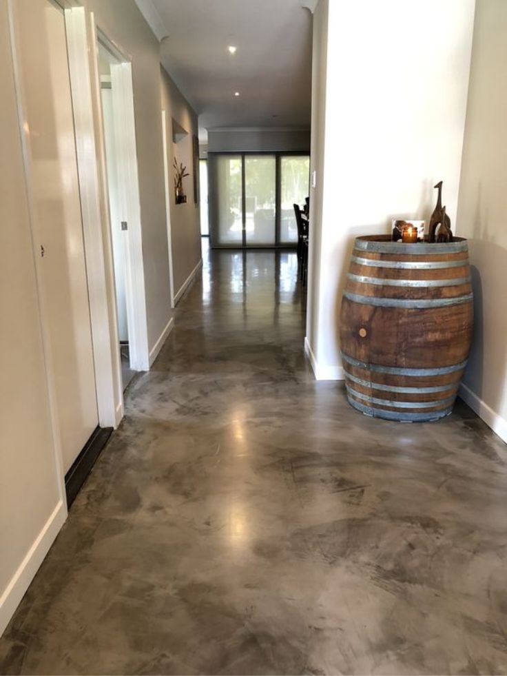 "Brown concrete floor in a Riyadh residence, offering a minimalist and durable flooring solution."